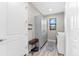 Bright laundry room with built-in cabinets and modern washer and dryer at 15576 Aldama Cir, Port Charlotte, FL 33981