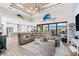 Spacious living area with large sectional sofa, high ceilings, and water views at 15576 Aldama Cir, Port Charlotte, FL 33981