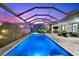 Lighted pool and spa with covered patio at 15576 Aldama Cir, Port Charlotte, FL 33981