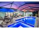 Lighted pool and spa with covered patio and interior view at 15576 Aldama Cir, Port Charlotte, FL 33981