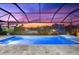 Enclosed pool and spa with sunset view at 15576 Aldama Cir, Port Charlotte, FL 33981