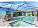 Inviting pool and spa with patio furniture at 15576 Aldama Cir, Port Charlotte, FL 33981