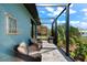 Relaxing screened patio with seating area, overlooking backyard at 15576 Aldama Cir, Port Charlotte, FL 33981