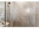 Modern shower with stone and tile detail at 15576 Aldama Cir, Port Charlotte, FL 33981