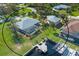 Aerial view of canal front home with private dock and pool at 5105 Ackley Ter, Port Charlotte, FL 33981