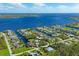 Aerial view showcasing home's waterfront location and neighborhood at 5105 Ackley Ter, Port Charlotte, FL 33981