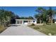 Ranch style home with a large yard and driveway at 1446 Fairless Rd, Englewood, FL 34223