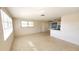 Open living area with a view into the kitchen and terrazzo floors at 1446 Fairless Rd, Englewood, FL 34223