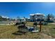 Community grills and picnic tables for outdoor entertaining at 6800 Placida Rd # 268, Englewood, FL 34224