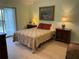 Bedroom with hardwood floors and private balcony at 6800 Placida Rd # 268, Englewood, FL 34224