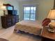 Bright bedroom with balcony access and hardwood floors at 6800 Placida Rd # 268, Englewood, FL 34224