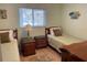 Guest bedroom with two twin beds and wood furniture at 6800 Placida Rd # 268, Englewood, FL 34224