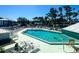 Inviting community pool with ample lounge chairs for sunbathing at 6800 Placida Rd # 268, Englewood, FL 34224