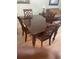 Dining area with wood table and four chairs at 6800 Placida Rd # 268, Englewood, FL 34224