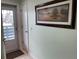 Bright condo entryway with a door leading to a balcony at 6800 Placida Rd # 268, Englewood, FL 34224