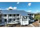 Building exterior with metal roof and balconies at 6800 Placida Rd # 268, Englewood, FL 34224