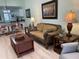 Living room with sofa, coffee table, and view into kitchen area at 6800 Placida Rd # 268, Englewood, FL 34224