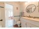 Nice bathroom, vanity, toilet, and shower, with a view into another room at 700 Coquina Ct, Nokomis, FL 34275