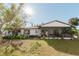 House exterior with a screened porch and hot tub at 700 Coquina Ct, Nokomis, FL 34275