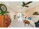 Bright living room featuring a comfy sofa, coffee table, and tiled floors at 700 Coquina Ct, Nokomis, FL 34275