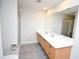 Modern bathroom with double vanity and walk-in shower at 1120 E Kennedy Blvd # 1423, Tampa, FL 33602