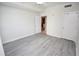 Bright bedroom with wood-look floors and access to a hallway at 1120 E Kennedy Blvd # 1423, Tampa, FL 33602