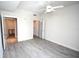 Well-lit bedroom with grey wood-look floors and closet at 1120 E Kennedy Blvd # 1423, Tampa, FL 33602