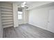 Bedroom with built-in shelving and wood-look floors at 1120 E Kennedy Blvd # 1423, Tampa, FL 33602