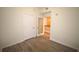 Simple bedroom with wood-look floors and kitchen access at 1120 E Kennedy Blvd # 1423, Tampa, FL 33602