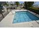 Relaxing community hot tub with tiled surround and steps at 1120 E Kennedy Blvd # 1423, Tampa, FL 33602