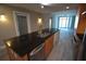 Kitchen island with granite countertop, double sink, and built-in dishwasher at 1120 E Kennedy Blvd # 1423, Tampa, FL 33602