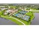 Aerial view of community amenities including tennis and pickleball courts at 13215 Amerigo Ln, Venice, FL 34293