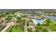 Aerial view of community amenities including pool, clubhouse, and playground at 13215 Amerigo Ln, Venice, FL 34293