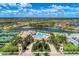 Community overview showcasing pool, clubhouse, and tennis courts at 13215 Amerigo Ln, Venice, FL 34293