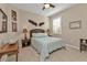 Cozy bedroom with a queen bed and window with shutters at 13215 Amerigo Ln, Venice, FL 34293