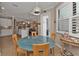 Breakfast nook with glass-top table and view of kitchen at 13215 Amerigo Ln, Venice, FL 34293