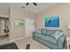 Comfortable guest room with sofa, large art piece, and built-in closet at 13215 Amerigo Ln, Venice, FL 34293