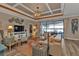 Spacious living room with coffered ceiling and views to the pool at 13215 Amerigo Ln, Venice, FL 34293