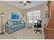 Home office with comfortable seating and large window at 13215 Amerigo Ln, Venice, FL 34293