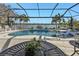 Relaxing screened pool and patio area overlooking lake at 13215 Amerigo Ln, Venice, FL 34293