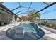 Resort-style pool with a relaxing swim-up seating area at 13215 Amerigo Ln, Venice, FL 34293