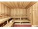 Relaxing wooden sauna with multiple benches at 13215 Amerigo Ln, Venice, FL 34293