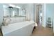 Bright bathroom featuring a standalone tub with marble countertop and double sinks at 180 Rotonda N Blvd, Rotonda West, FL 33947