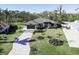 Single-Gathering home with a large yard and paved driveway at 2213 Oleada Ct, Englewood, FL 34224