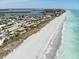 Beachfront aerial view showcasing pristine beach and ocean at 2213 Oleada Ct, Englewood, FL 34224