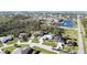 Aerial view of a residential neighborhood showcasing homes and landscaping at 2213 Oleada Ct, Englewood, FL 34224