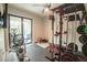 Home gym with various equipment including weights and a stationary bike at 2213 Oleada Ct, Englewood, FL 34224