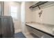 Laundry room with a folding counter and storage at 2213 Oleada Ct, Englewood, FL 34224