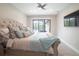 Spacious main bedroom with large bed, plenty of pillows and access to the pool at 2213 Oleada Ct, Englewood, FL 34224