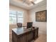 Home office with large desk and window with plantation shutters at 2213 Oleada Ct, Englewood, FL 34224